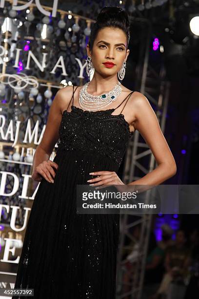 Model walks down the ramp during grand finale by Shree Raj Mahal Jewellers as a part of India Couture Week 2014 at the Taj Palace Hotel on July 20,...