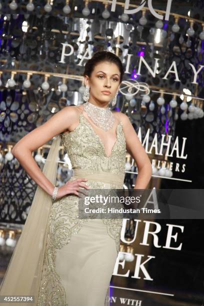 Model walks down the ramp during grand finale by Shree Raj Mahal Jewellers as a part of India Couture Week 2014 at the Taj Palace Hotel on July 20,...