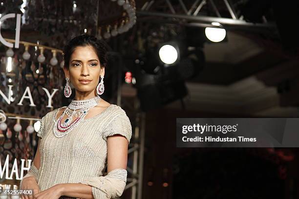 Model walks down the ramp during grand finale by Shree Raj Mahal Jewellers as a part of India Couture Week 2014 at the Taj Palace Hotel on July 20,...