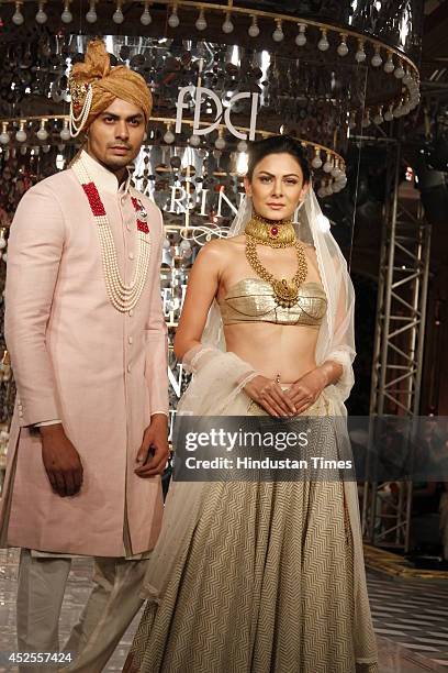 Model walk down the ramp during grand finale by Shree Raj Mahal Jewellers as a part of India Couture Week 2014 at the Taj Palace Hotel on July 20,...