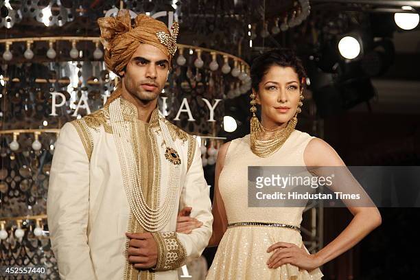 Model walk down the ramp during grand finale by Shree Raj Mahal Jewellers as a part of India Couture Week 2014 at the Taj Palace Hotel on July 20,...