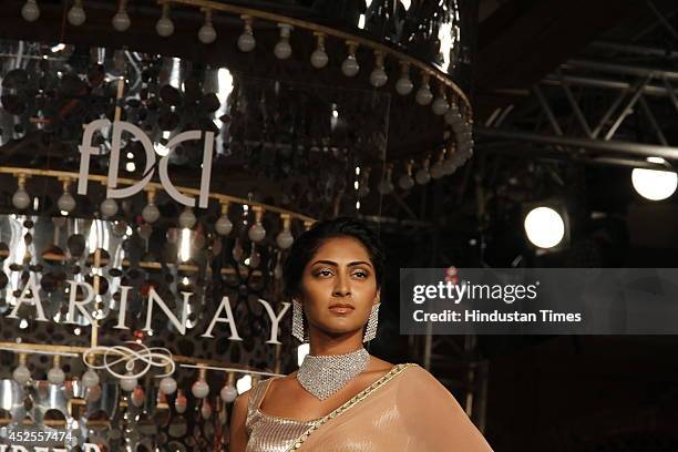 Model walks down the ramp during grand finale by Shree Raj Mahal Jewellers as a part of India Couture Week 2014 at the Taj Palace Hotel on July 20,...