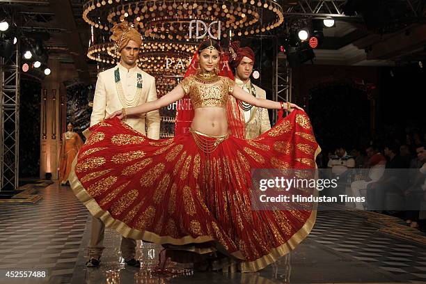 Model walk down the ramp during grand finale by Shree Raj Mahal Jewellers as a part of India Couture Week 2014 at the Taj Palace Hotel on July 20,...