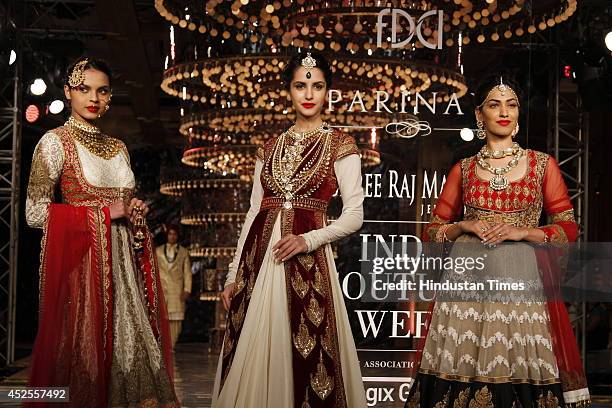 Model walk down the ramp during grand finale by Shree Raj Mahal Jewellers as a part of India Couture Week 2014 at the Taj Palace Hotel on July 20,...