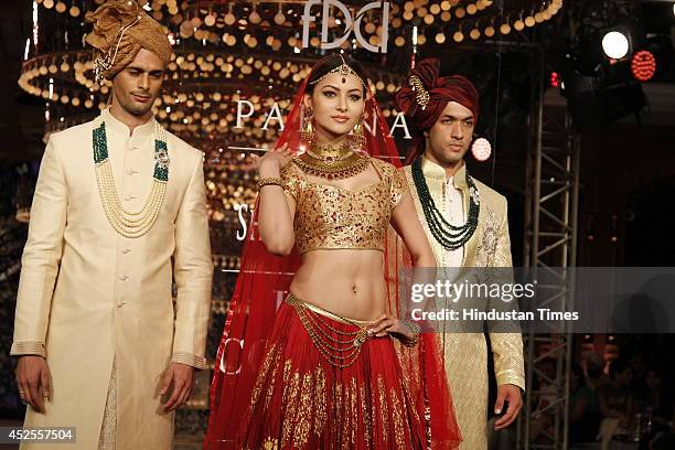 Model walk down the ramp during grand finale by Shree Raj Mahal Jewellers as a part of India Couture Week 2014 at the Taj Palace Hotel on July 20,...