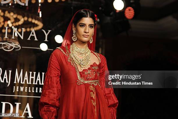 Model walks down the ramp during grand finale by Shree Raj Mahal Jewellers as a part of India Couture Week 2014 at the Taj Palace Hotel on July 20,...