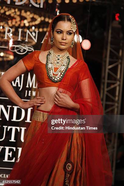 Model walks down the ramp during grand finale by Shree Raj Mahal Jewellers as a part of India Couture Week 2014 at the Taj Palace Hotel on July 20,...