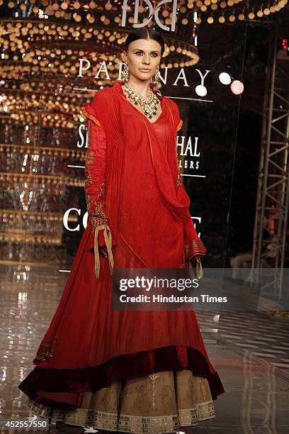 Model walks down the ramp during grand finale by Shree Raj Mahal Jewellers as a part of India Couture Week 2014 at the Taj Palace Hotel on July 20,...