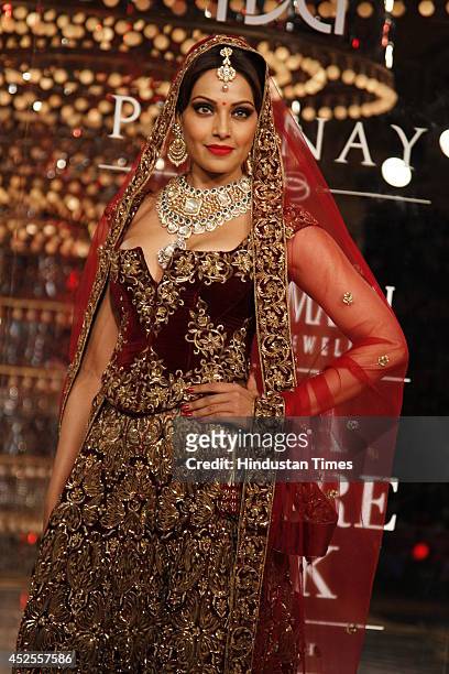 Actresses Bipasha Basu glided down the ramp in designer Rohit Bal lehanga for Shree Raj Mahal Jewellers at the India Couture Week 2014 finale held on...
