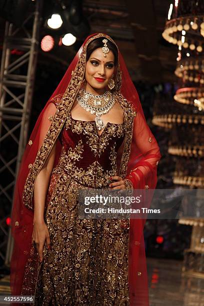 Actresses Bipasha Basu glided down the ramp in designer Rohit Bal lehanga for Shree Raj Mahal Jewellers at the India Couture Week 2014 finale held on...