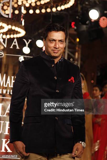 Filmmaker Madhur Bhandarkar walked down the ramp for Shree Raj Mahal Jewellers at the India Couture Week 2014 finale held on July 20, 2014 in New...