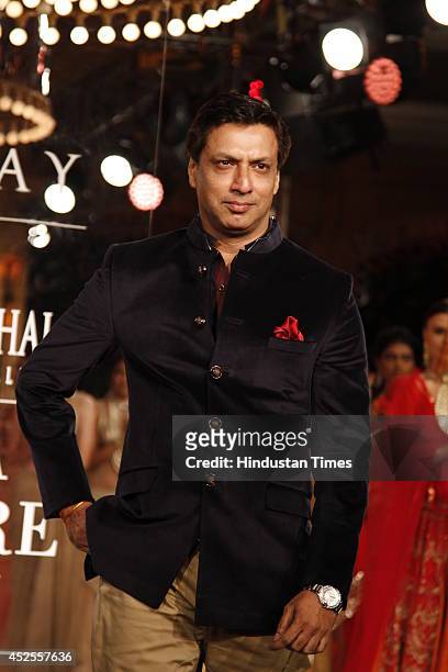 Filmmaker Madhur Bhandarkar walked down the ramp for Shree Raj Mahal Jewellers at the India Couture Week 2014 finale held on July 20, 2014 in New...