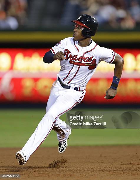 Centerfielder B.J. Upton of the Atlanta Braves runs past second base during the game against the New York Mets at Turner Field on June 30, 2014 in...
