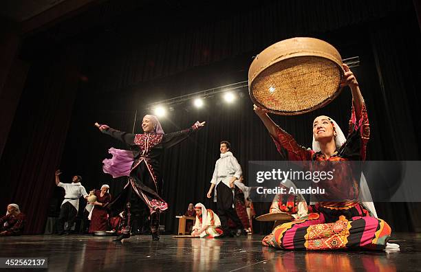 Al Hannounah, Jordanian group of Palestinian roots members, performs traditional Palestinian dance during a special celebration in solidarity with...