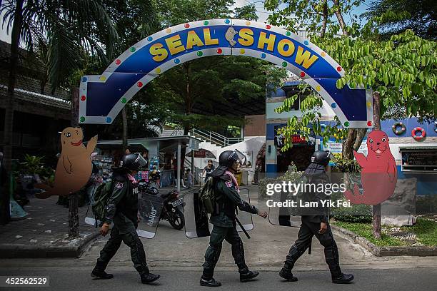 Riot police guard the zoo inside the government housing area on November 30, 2013 in Bangkok, Thailand. Anti-government protesters in Bangkok say...