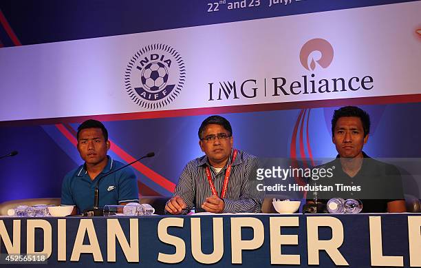 Bengaluru FC players Jeje Lalpekhlua and Gouramangi Singh with team official during the player draft of Hero Indian Super league on July 23, 2014 in...