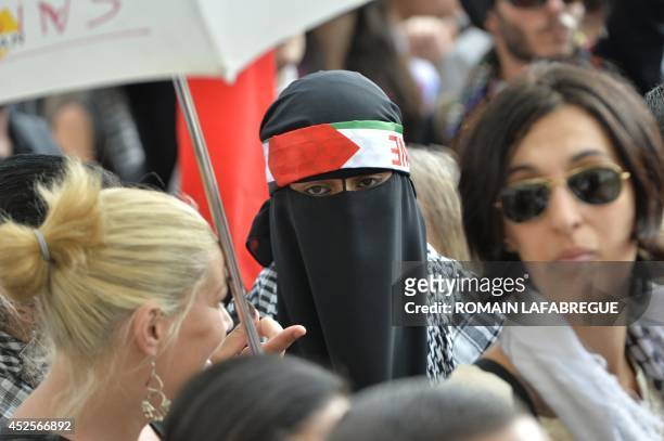 Woman wearing a veil poses on the Terreaux Square, in Lyon, central-eastern France, on July 23, 2014 during a demonstration to denounce Israel's...