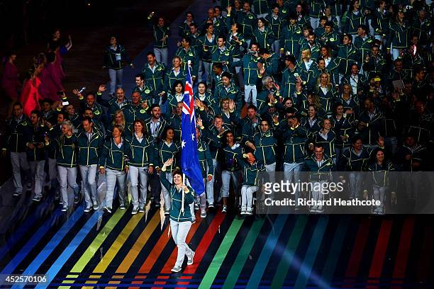 Flag bearer and Cyclist Anna Meares of Australia waves during the Opening Ceremony for the Glasgow 2014 Commonwealth Games at Celtic Park on July 23,...