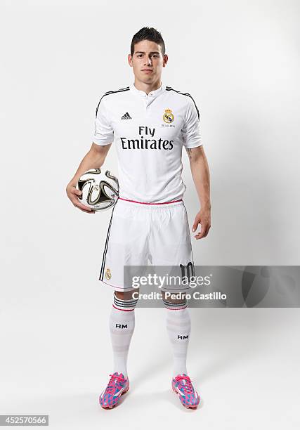 James Rodriguez poses during his official unveiling as a new Real Madrid player at Estadio Santiago Bernabeul on July 22, 2014 in Madrid, Spain.