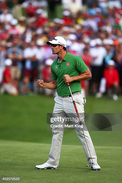 Adam Scott of Australia celebrates sinking his birdie putt on the 18th hole during day three of the Australian Open at Royal Sydney Golf Club on...