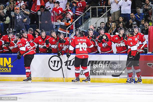 Greg Chase, Morgan Klimchuk, and Madison Bowey of the WHL All-Stars celebrate with the bench after a goal against team Russia during Game Six of the...