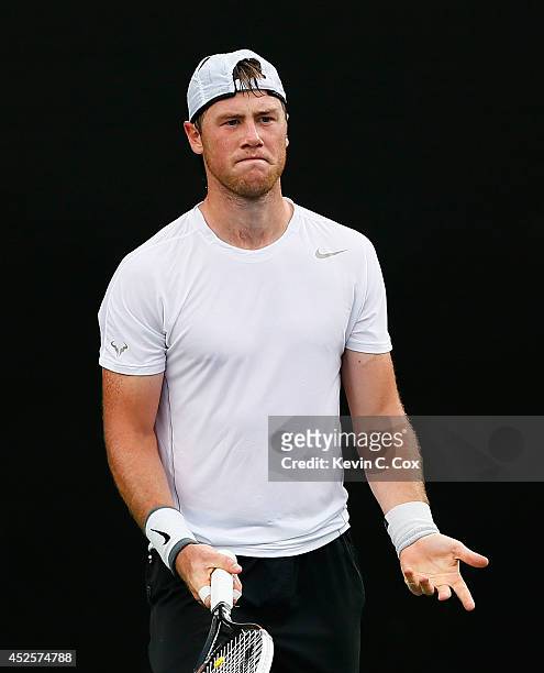 Illya Marchenko of the Ukraine reacts after a point by Vasek Pospisil of Canada during the BB&T Atlanta Open at Atlantic Station on July 23, 2014 in...