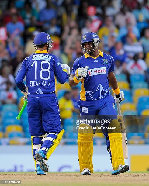 Shoaib Malik and Dwayne Smith of Barbados Tridents 100 runs partnership during a match between Barbados Tridents and St. Lucia Zouks as part of the...