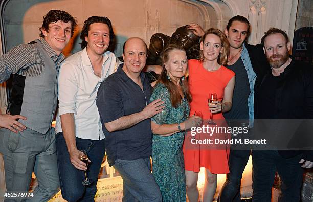 Cast members Sandy Murray, David Oakes, Paul Chahidi, Anna Carteret, Lucy Briggs-Owen, Tom Bateman and David Ganly pose in front of a statue of...