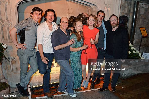Cast members Sandy Murray, David Oakes, Paul Chahidi, Anna Carteret, Lucy Briggs-Owen, Tom Bateman and David Ganly pose in front of a statue of...