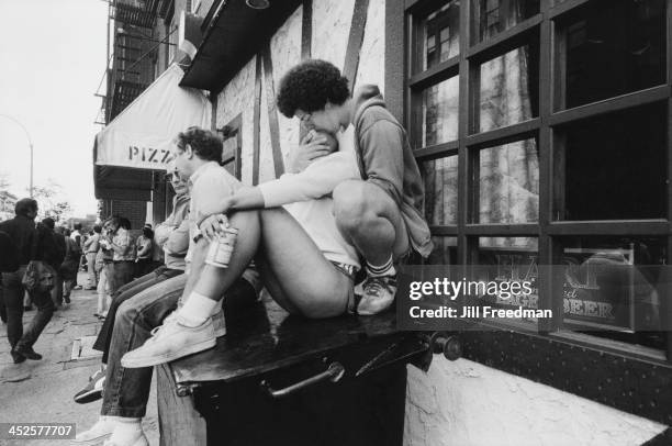 Young couple kiss on the street in Greenwich Village, New York City, 1979.