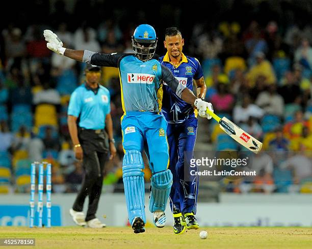 Rayad Emrit of Barbados Tridents collides with Darren Sammy of St. Lucia Zouks during a match between Barbados Tridents and St. Lucia Zouks as part...