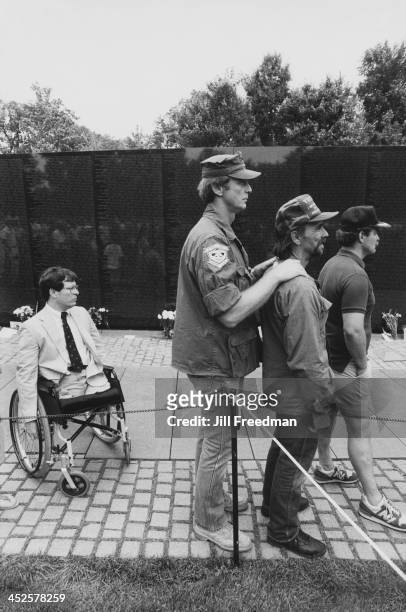 Veterans of the Vietnam War at the Vietnam Veterans Memorial in Washington DC, circa 1987.