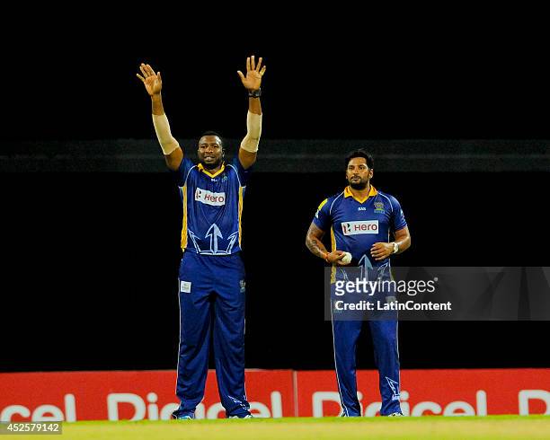 Kieron Pollard of Barbados Tridents sets the field for his bowler Ravi Rampaul during a match between Barbados Tridents and St. Lucia Zouks as part...