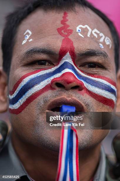 Anti-government protester take part in a rally at Democracy Monument on November 30, 2013 in Bangkok, Thailand. Anti-government protesters in Bangkok...