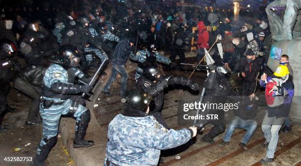 Protesters clash with police on Independence Square in Kiev early morning on November 30, 2013. Dozens of protesters were wounded in Ukraine's...