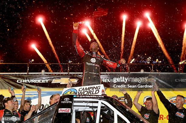 Darrell Wallace Jr. , driver of the ToyotaCare Toyota, celebrates after winning the Camping World Truck 2nd Annual 1-800 Car Cash Mudsummer Classic...