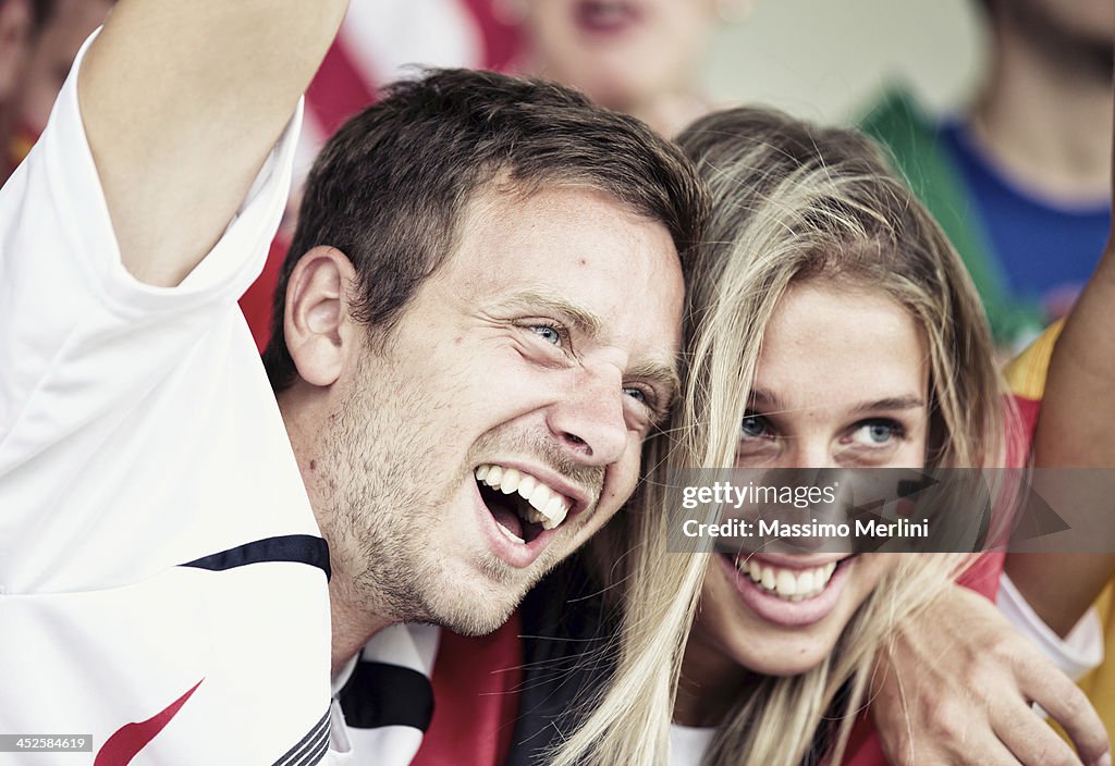 Sports fans cheering a game