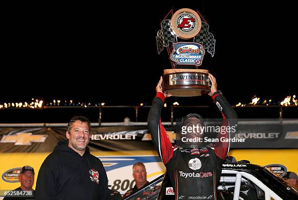 Darrell Wallace Jr. , driver of the ToyotaCare Toyota, celebrates with Toney Stewart after winning the Camping World Truck 2nd Annual 1-800 Car Cash...