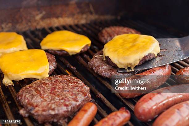 spatula with cheeseburger on grill - cheeseburger grill stock pictures, royalty-free photos & images
