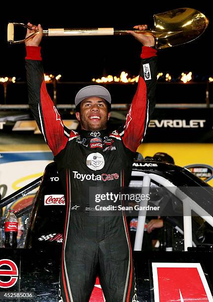 Darrell Wallace Jr. , driver of the ToyotaCare Toyota, celebrates after winning the Camping World Truck 2nd Annual 1-800 Car Cash Mudsummer Classic...
