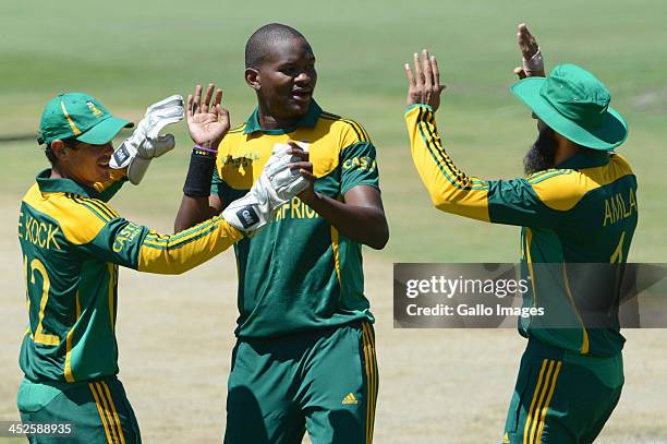 Lonwabo Tsotsobe of South Africa celebrates the wicket of Asad Shafiq of Pakistan with his team-mates during the 3rd One Day International match...