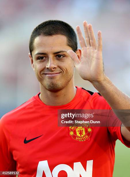 Mexico star Javier "Chicharito" Hernandez of Manchester United waves to fans as he trains before the game with the Los Angeles Galaxy at the Rose...