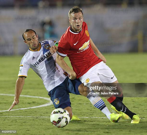 Tom Cleverley of Manchester United in action with Landon Donovan of Los Angeles Galaxy during the pre-season friendly match between LA Galaxy and...