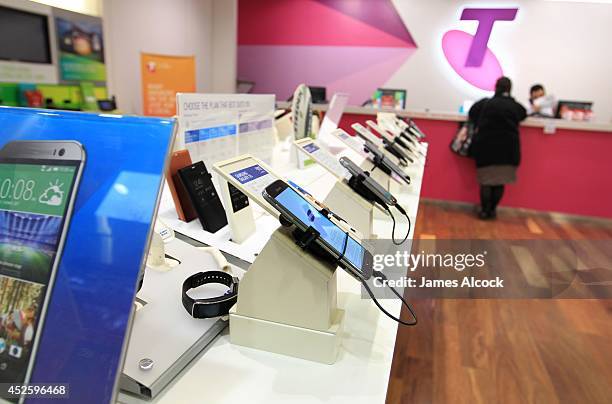 Mobile phones products and consumer telecommunications technology on display in a Telstra retail store in Sydney on July 24, 2014 in Sydney,...