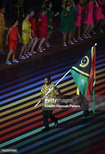 Flag bearer and Table Tennis player Yoshua Shing of Vanuatu during the Opening Ceremony for the Glasgow 2014 Commonwealth Games at Celtic Park on...