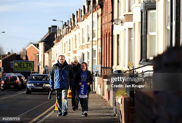Fans make their way to the stadium ahead of the Barclays Premier League match between Everton and Stoke City at Goodison Park on November 30, 2013 in...