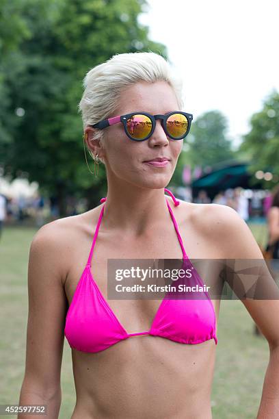 Presenter and Model Danni Menzies wearing Brick Lane market sunglasses, Primark bikini at Lovebox 2014 on July 19, 2014 in London, England.