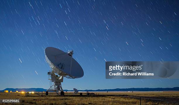 Star trails on a clear night behind a radio astronomy antenna at the Very Large Array near Socorro, New Mexico.