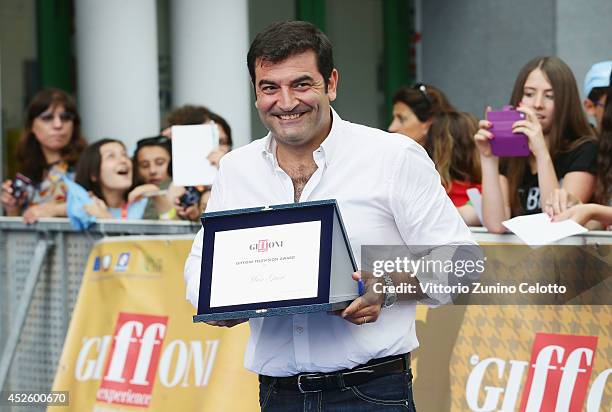 Max Giusti poses with the Giffoni Award during the Giffoni Film Festival on July 24, 2014 in Giffoni Valle Piana, Italy.