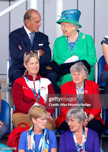 Prince Philip, Duke of Edinburgh and Queen Elizabeth II watch the England vs Wales women's hockey match at the Glasgow National Hockey Centre during...